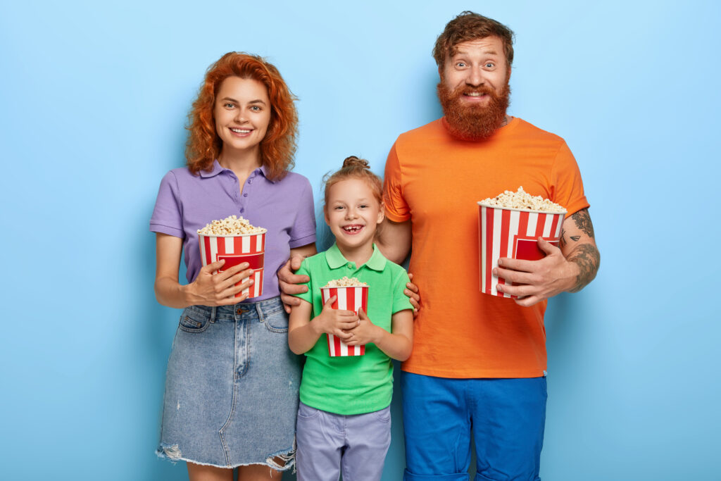 ginger-family-spend-free-time-cinema-watch-funny-movie-smile-happily-eat-delicious-popcorn-stand-closely-each-other-enjoy-togetherness-entertain-themselves-leisure-family-time-concept-1024x683.jpg
