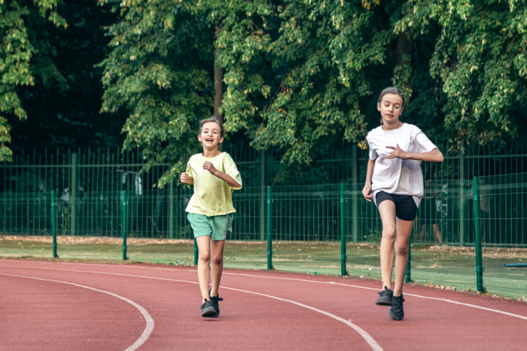 child-fitness-teenager-girls-running-stadium-track-1024x683.jpg